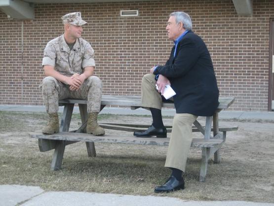 Dan Rather with U.S. Marine Corporal Yerandys Martell-Carrasco